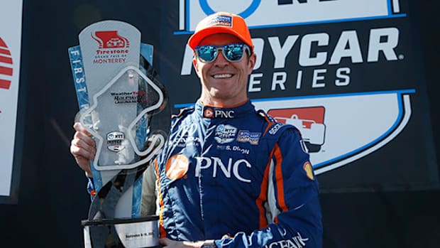 Scott Dixon shows off his shiny trophy for winning Sunday's IndyCar season finale at Laguna Seca. Photo courtesy IndyCar.